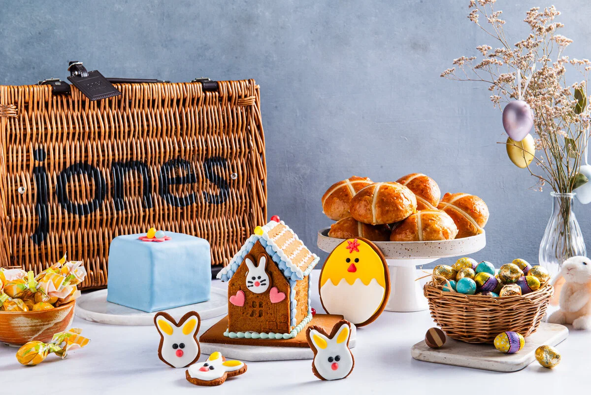 Easter treats and pastries displayed beside a Jones the Grocer basket.